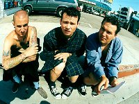 Blink 182  Mark Hoppus and the band in a parking lot.